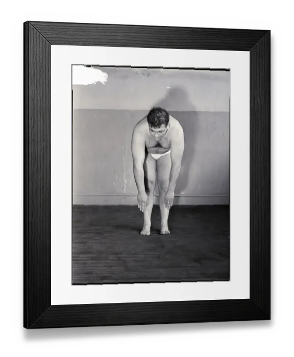 Framed Print : Man Doing Standing Forward Bend Framed Print : Man Doing Standing Forward Bend