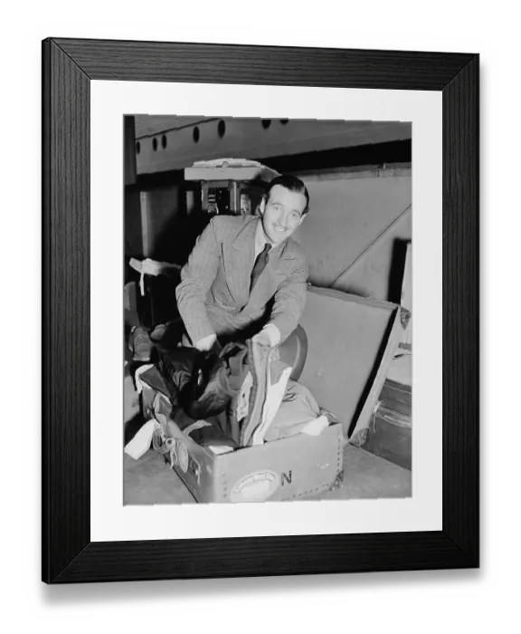 Framed Print : David Niven On Ship with Open Suitcase Framed Print : David Niven On Ship with Open Suitcase