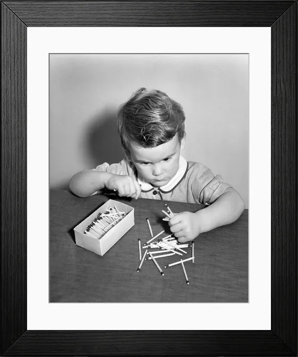 Framed Print : Little Boy Playing with Matches Framed Print : Little Boy Playing with Matches