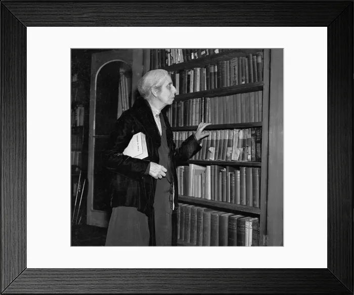 Framed Print : Alice Stone Blackwell Looking Through Bookshelf