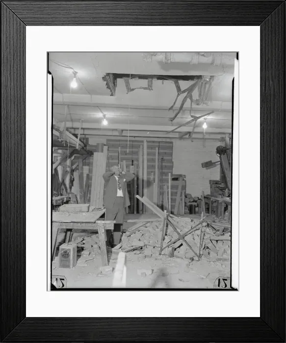 Framed Print : Owner Standing in Ruins of Store