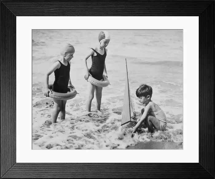 Framed Print : Youngsters Enjoying the Beach with Toy Sailboat Framed Print : Youngsters Enjoying the Beach with Toy Sailboat