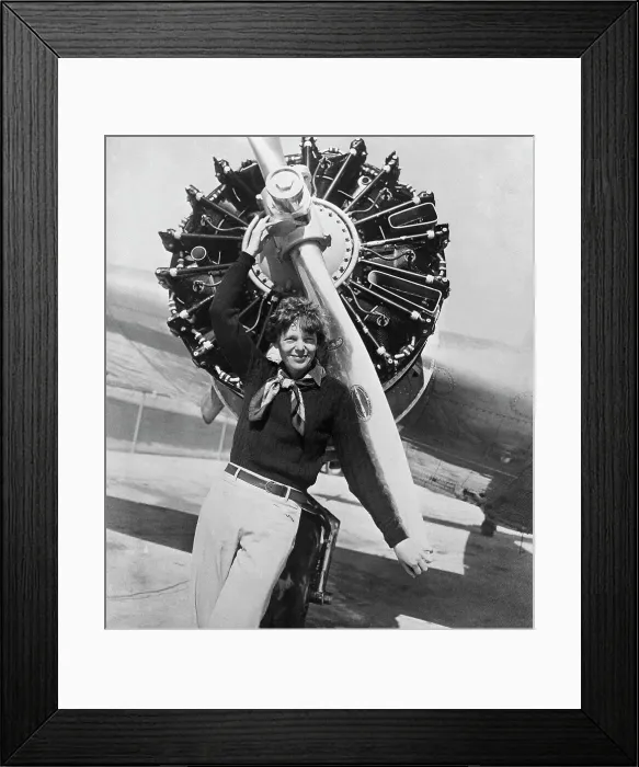 Framed Print : Amelia Earhart Posing Before Her Plane's Propeller