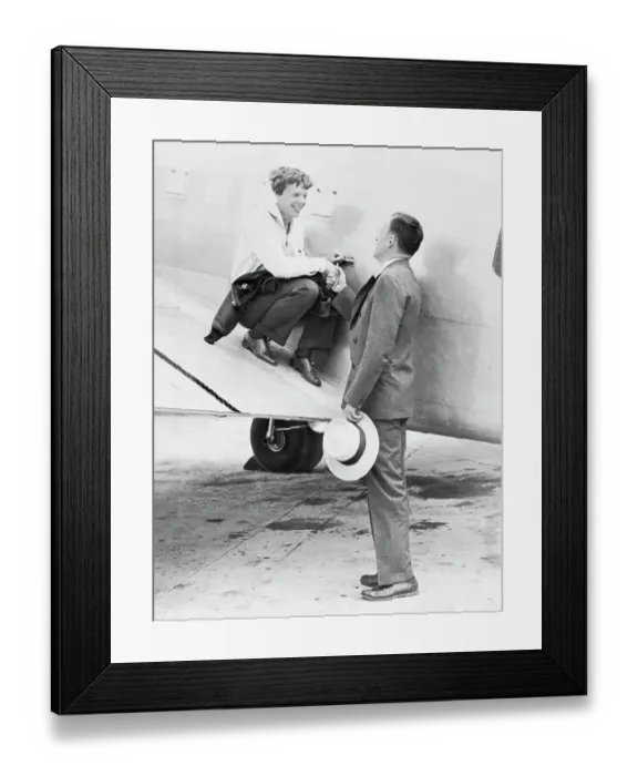 Framed Print : Amelia Earhart and Husband George Putnam Saying Goodbye Framed Print : Amelia Earhart and Husband George Putnam Saying Goodbye