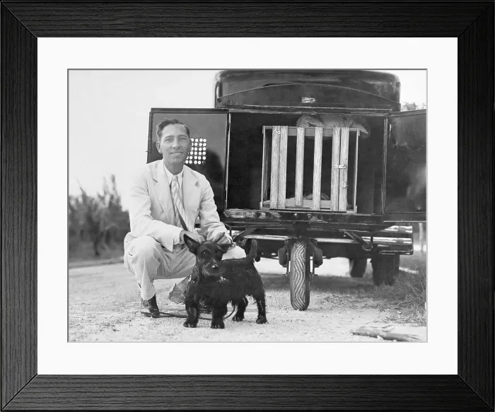 Framed Print : Man and Dog Near Dog Trailer Framed Print : Man and Dog Near Dog Trailer