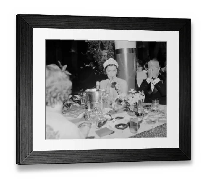 Framed Print : Woman Putting on Lipstick at Restaurant Framed Print : Woman Putting on Lipstick at Restaurant