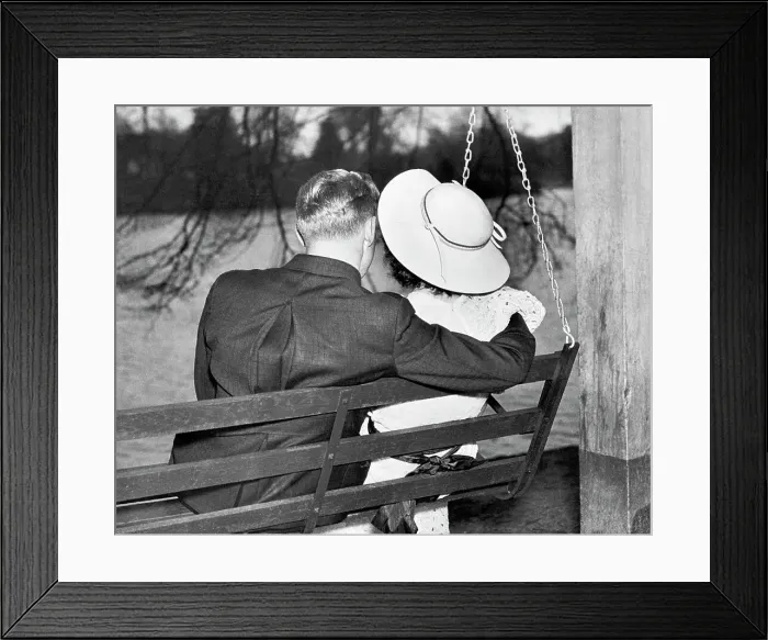 Framed Print : Couple Sitting Together on a Swing Framed Print : Couple Sitting Together on a Swing
