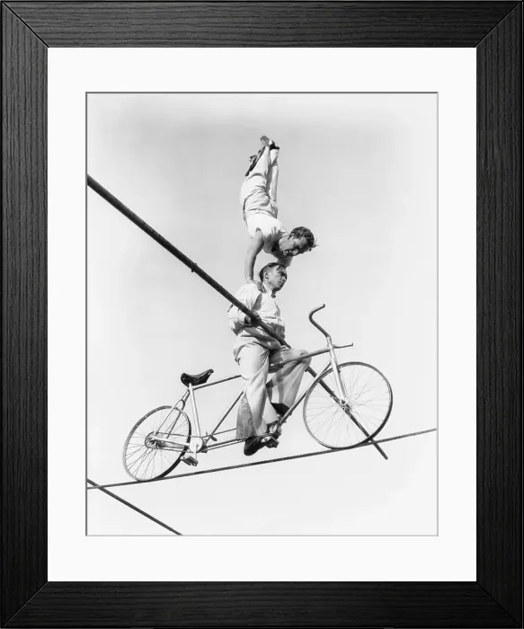 Framed Print : Wallenda Brothers Performing High Wire Stunt Framed Print : Wallenda Brothers Performing High Wire Stunt