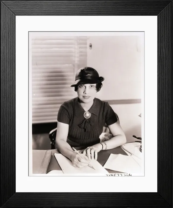 Framed Print : Anita Loos Looks Up from Desk
