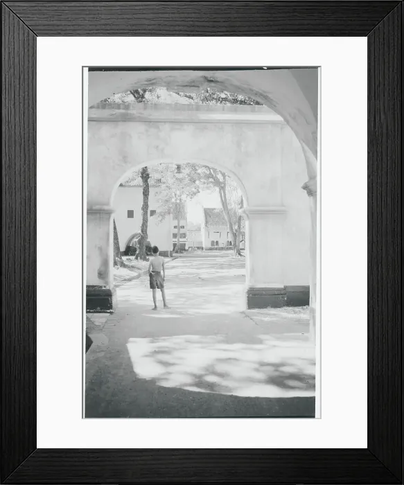Framed Print : Boy Gazing out from Underneath Archway Framed Print : Boy Gazing out from Underneath Archway