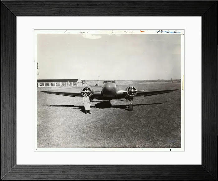 Framed Print : Man Standing with 1930s Aircraft Framed Print : Man Standing with 1930s Aircraft