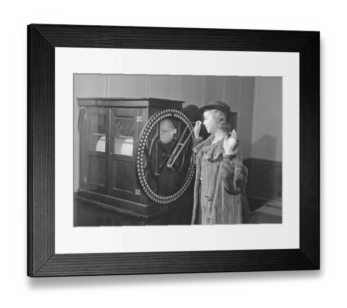 Framed Print : Woman Punching in on Rotary Time Clock Framed Print : Woman Punching in on Rotary Time Clock