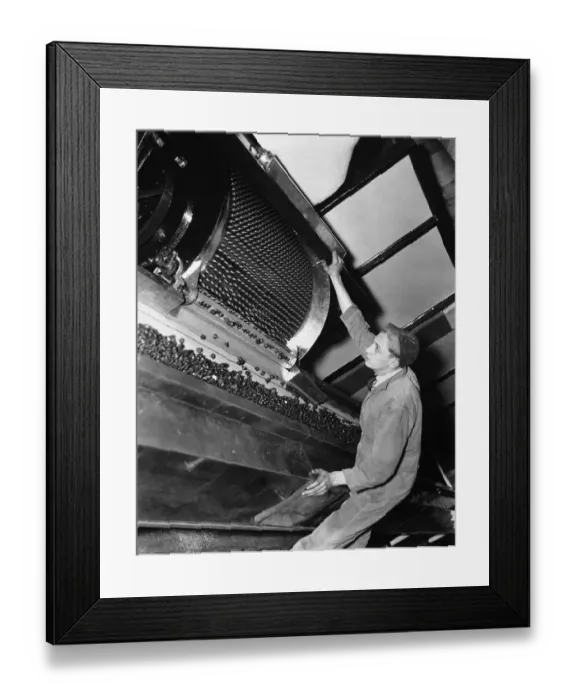 Framed Print : Man Watches Machine Making Hershey's Kisses in Factory