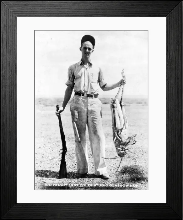 Framed Print : Man Holding Giant Grasshopper Framed Print : Man Holding Giant Grasshopper