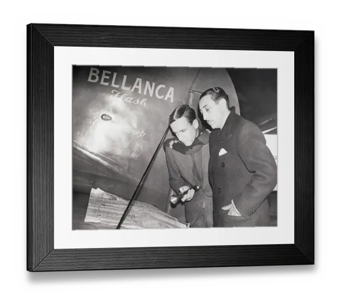 Framed Print : Pilots Reading Newspaper on the Wing of a Plane Framed Print : Pilots Reading Newspaper on the Wing of a Plane
