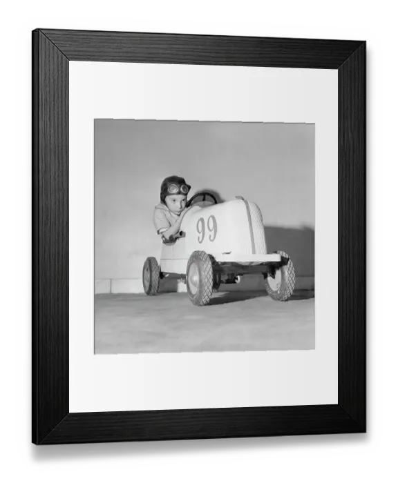 Framed Print : Child Sitting in Toy Car Framed Print : Child Sitting in Toy Car