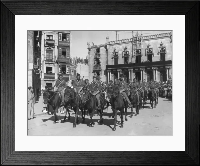 Framed Print : Cavalry Troops Ride Through Town On Horses