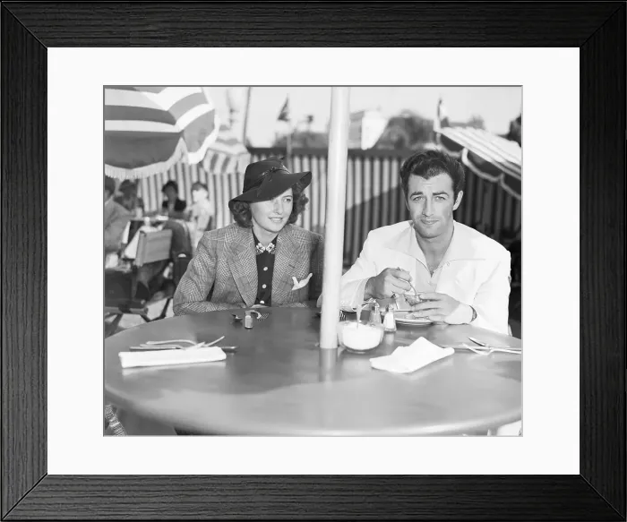 Framed Print : Barbara Stanwyck and Robert Taylor Seated