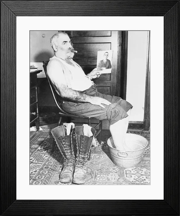 Framed Print : Lucky Blackiet Holding Picture of Man Framed Print : Lucky Blackiet Holding Picture of Man