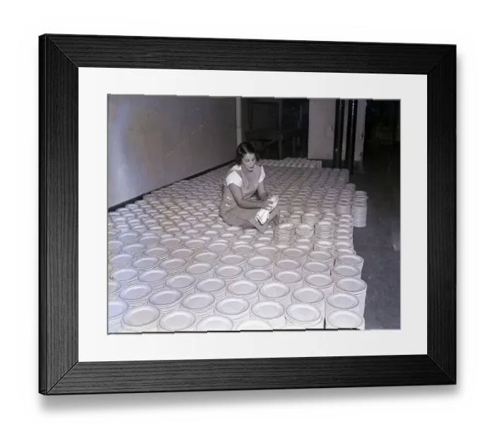 Framed Print : Woman Polishing Piles of Plates Framed Print : Woman Polishing Piles of Plates