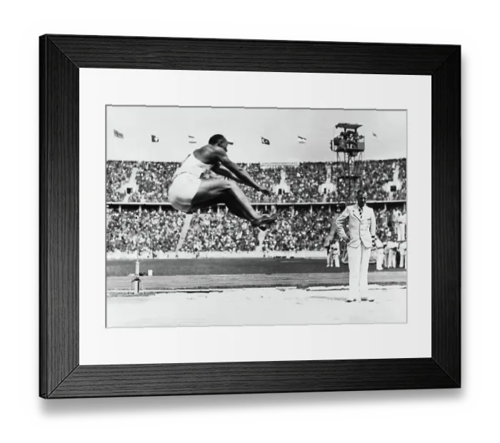 Framed Print : Jesse Owens Competing in Long Jump Framed Print : Jesse Owens Competing in Long Jump