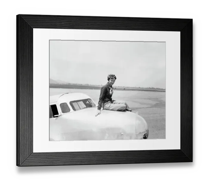 Framed Print : Aviatrix Amelia Earhart Posing on Airplane