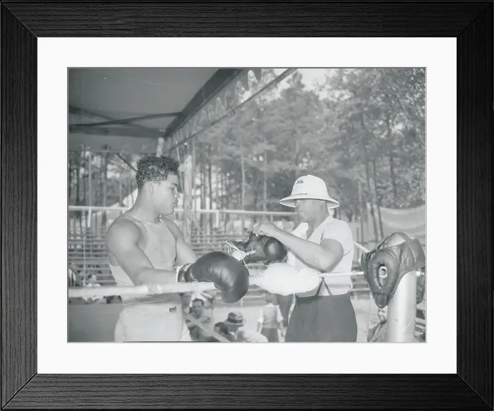 Framed Print : Joe Blackburn Removing Joe Louis Gloves