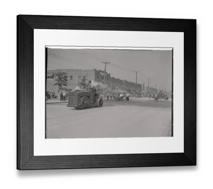 Framed Print : View of Steamroller Moving Down Street Framed Print : View of Steamroller Moving Down Street