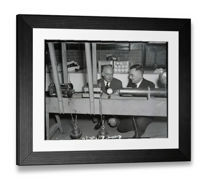 Framed Print : Men Observe Machine For Testing Baseball Framed Print : Men Observe Machine For Testing Baseball
