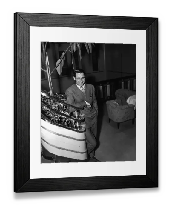 Framed Print : Cary Grant Posing Near Staircase Framed Print : Cary Grant Posing Near Staircase