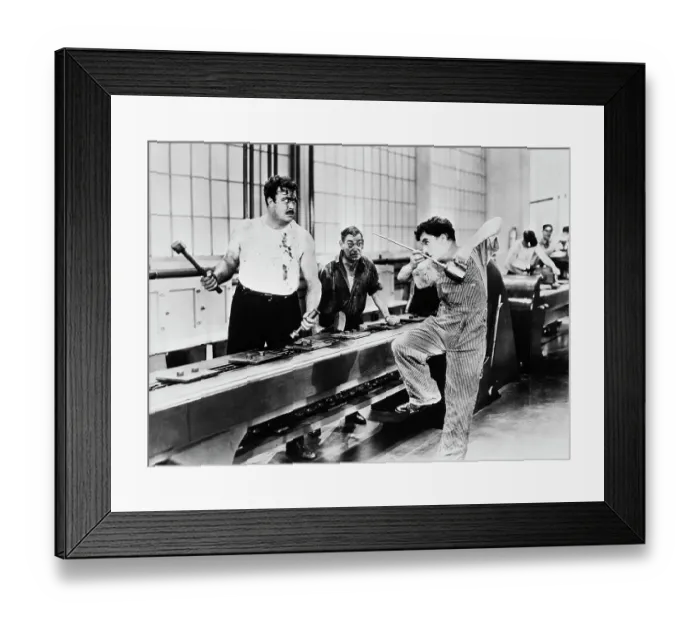 Framed Print : Charlie Chaplin Antagonizing Coworker Framed Print : Charlie Chaplin Antagonizing Coworker