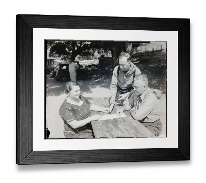 Framed Print : Mrs. Eisenmeger Looks At Photo Of Judge Framed Print : Mrs. Eisenmeger Looks At Photo Of Judge