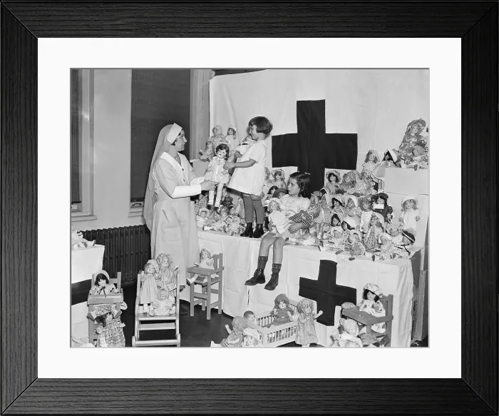 Framed Print : Red Cross Nurse with Girls Surrounded by Dolls Framed Print : Red Cross Nurse with Girls Surrounded by Dolls