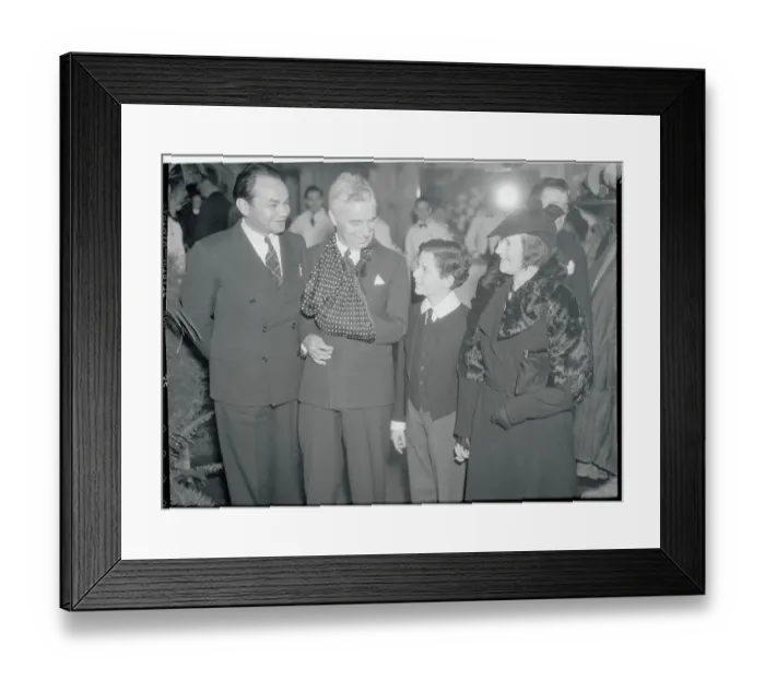 Framed Print : Charlie Chaplin Speaking with Colleagues Framed Print : Charlie Chaplin Speaking with Colleagues