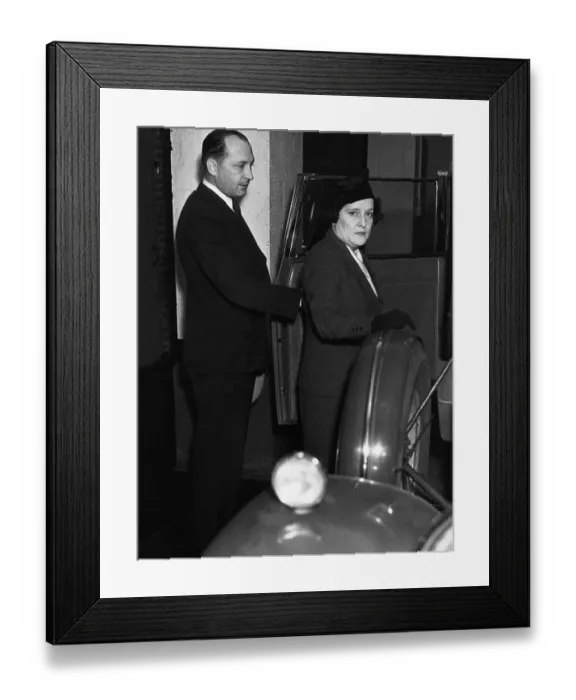 Framed Print : Man Escorting Woman into Car Framed Print : Man Escorting Woman into Car
