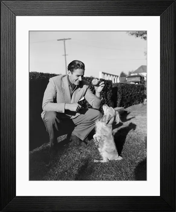 Framed Print : Errol Flynn Playing with Pet Dog Framed Print : Errol Flynn Playing with Pet Dog
