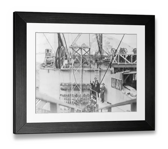Framed Print : Men Watching Spinning Cable Operation Framed Print : Men Watching Spinning Cable Operation