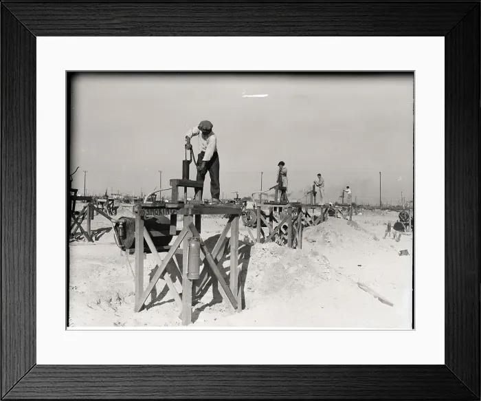 Framed Print : Workers Standing On Miniature Oil Wells Framed Print : Workers Standing On Miniature Oil Wells