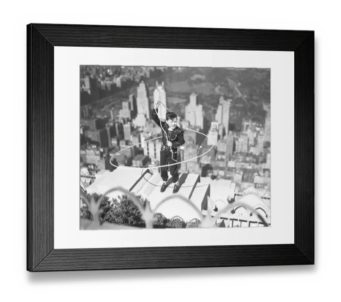 Framed Print : Boy on Ledge Twirling a Lasso Framed Print : Boy on Ledge Twirling a Lasso
