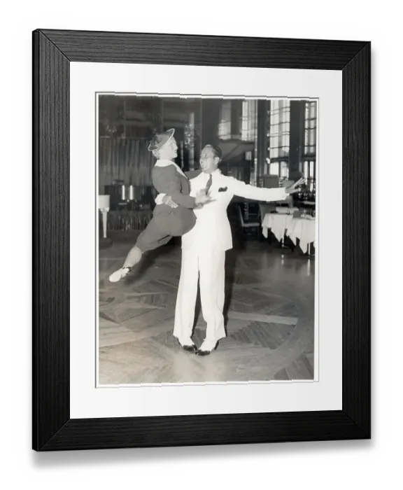 Framed Print : Man Holding Woman in Air Framed Print : Man Holding Woman in Air