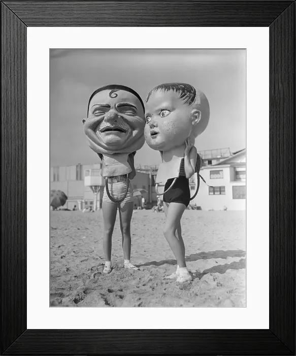 Framed Print : Women Wearing Large Papier Mache Heads Framed Print : Women Wearing Large Papier Mache Heads