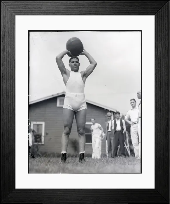 Framed Print : Joe Louis Holds Medicine Ball Above Head