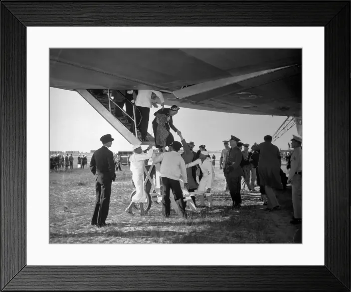 Framed Print : Woman Being Helped Out of the Hindenburg Framed Print : Woman Being Helped Out of the Hindenburg