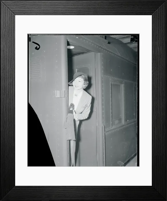 Framed Print : Claudette Colbert Peaking at the Camera From a Door Framed Print : Claudette Colbert Peaking at the Camera From a Door