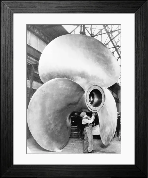 Framed Print : Man Working With Large Propeller Apparatus Framed Print : Man Working With Large Propeller Apparatus