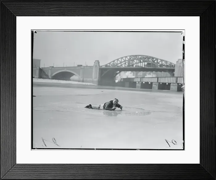 Framed Print : Man Lying on Icy River Framed Print : Man Lying on Icy River