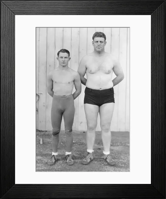 Framed Print : Clyde Moore Standing Next to Warren McDouglas