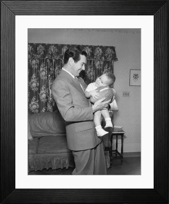 Framed Print : Johnny Mack Brown Holding His Son