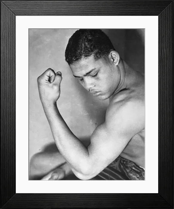 Framed Print : Joe Louis Examining His Muscle Framed Print : Joe Louis Examining His Muscle
