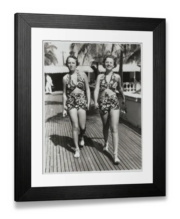 Framed Print : Sisters Wearing Matching Swimsuits